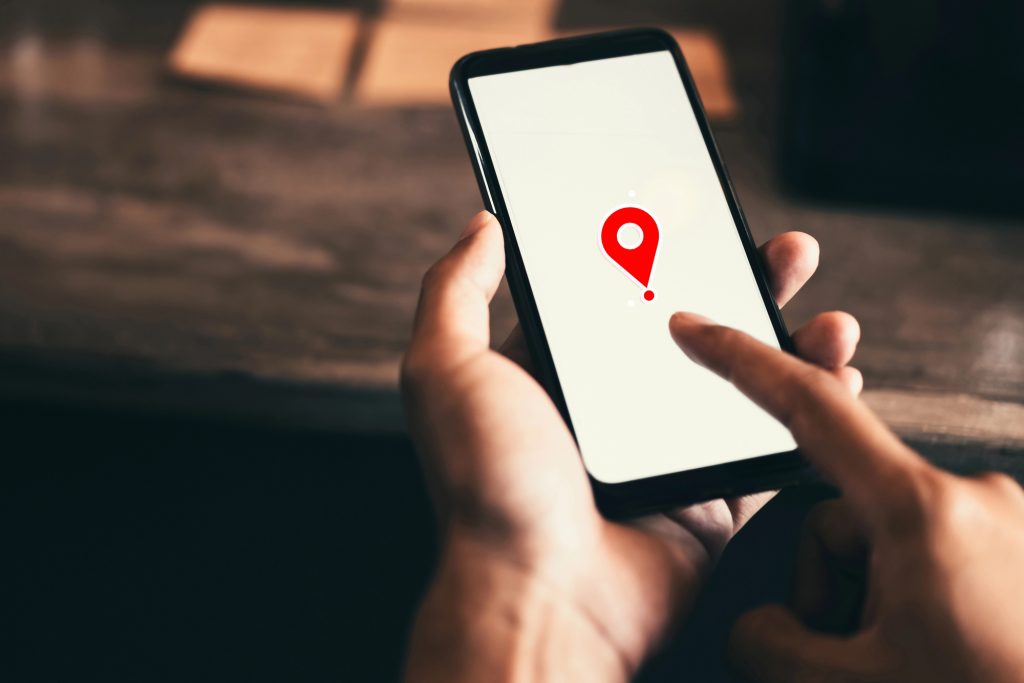 Customer using a phone map to find a nearby local business